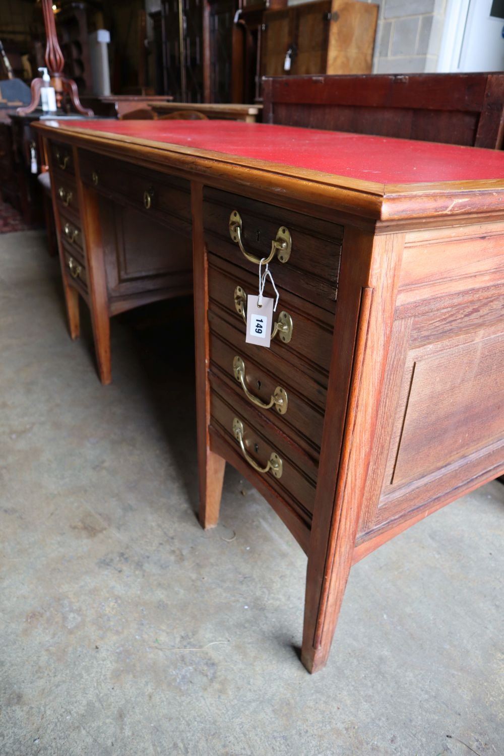 An Edwardian oak and walnut desk, width 160cm depth 74cm height 76cm